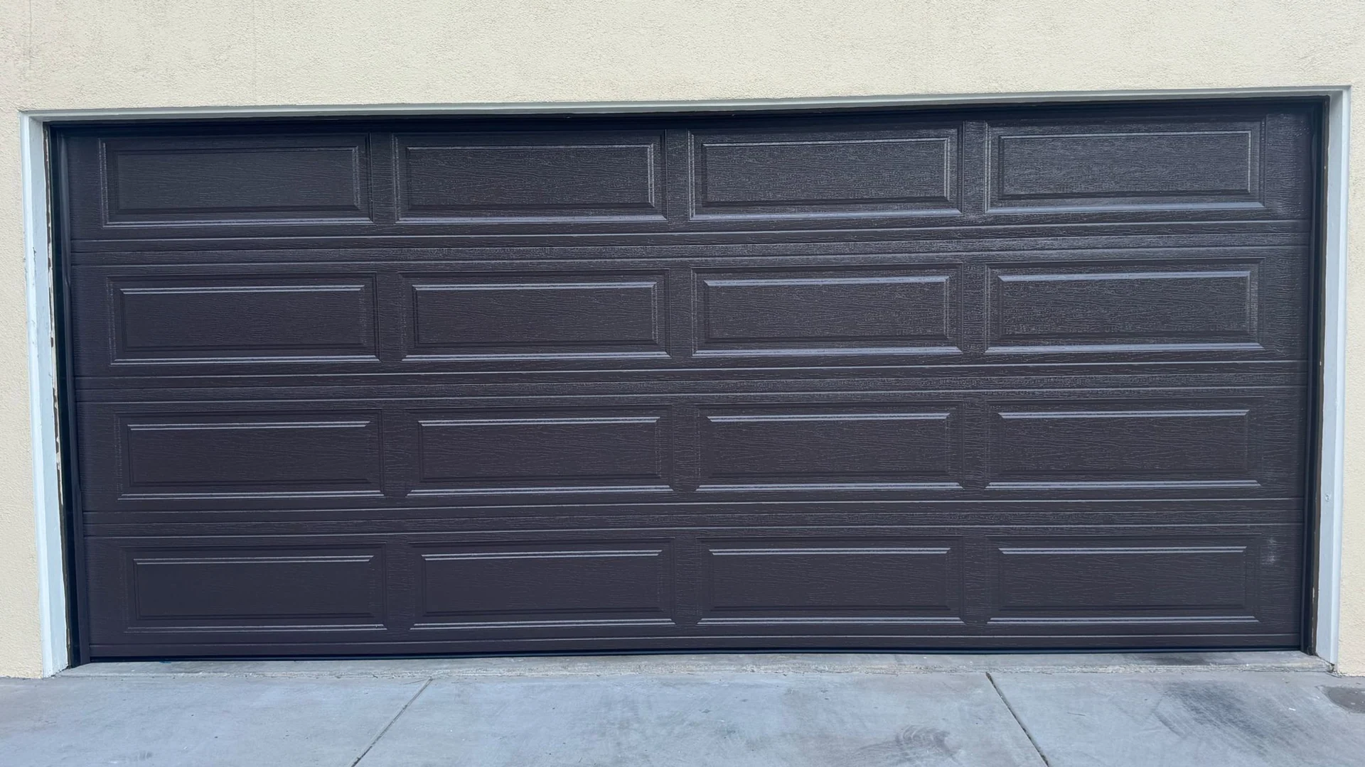Residential sectional garage door and driveway